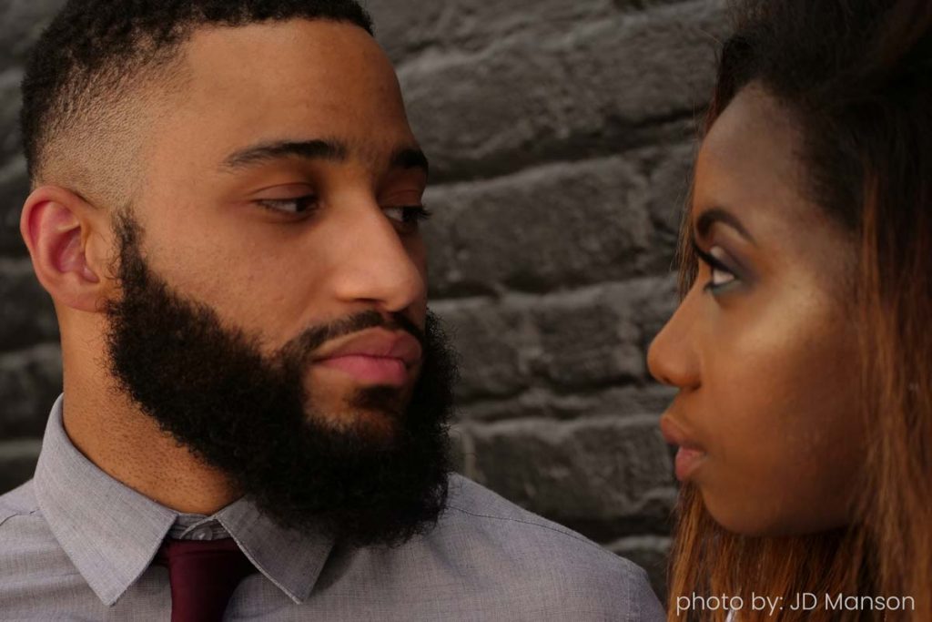 couple in a toxic relationship look into each other eyes

