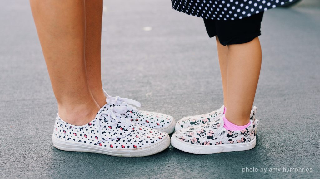 mom and parent in disneyland shoes
