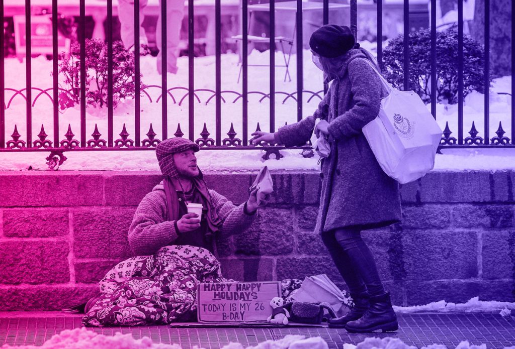 altruistic female giving homeless man money for social media validation