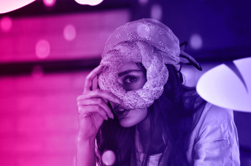 Holding bread and allowing breadcrumbs to keep ex partner engaged with strings attached to their heart
