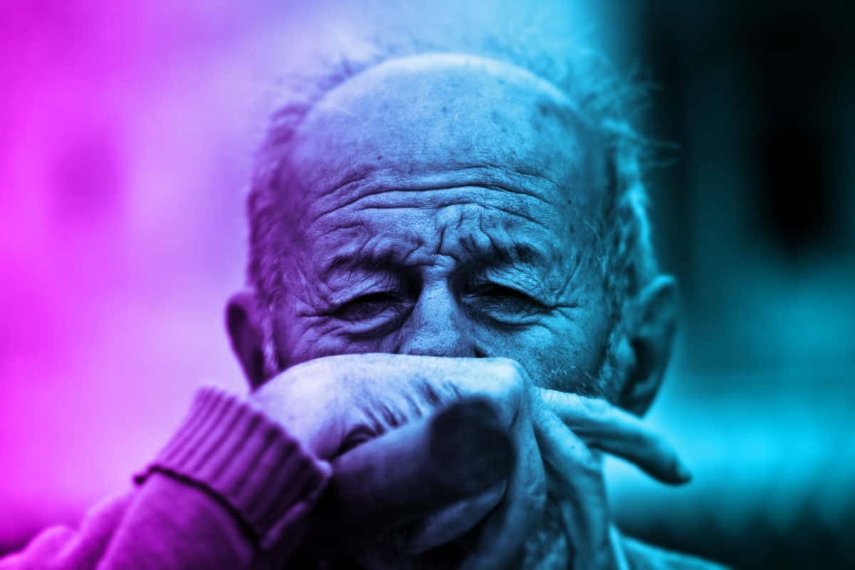 old man crying with hand over mouth because narcissistic supply is running low