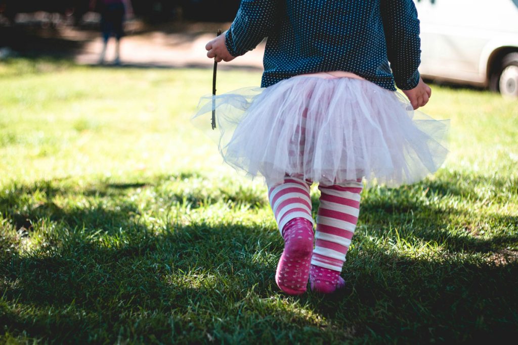 child alienated from parent walking on grass