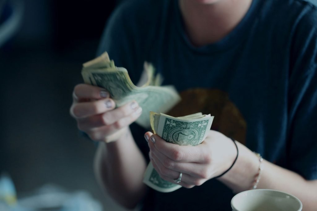 woman financially dependent on abuser and given few dollars allowance