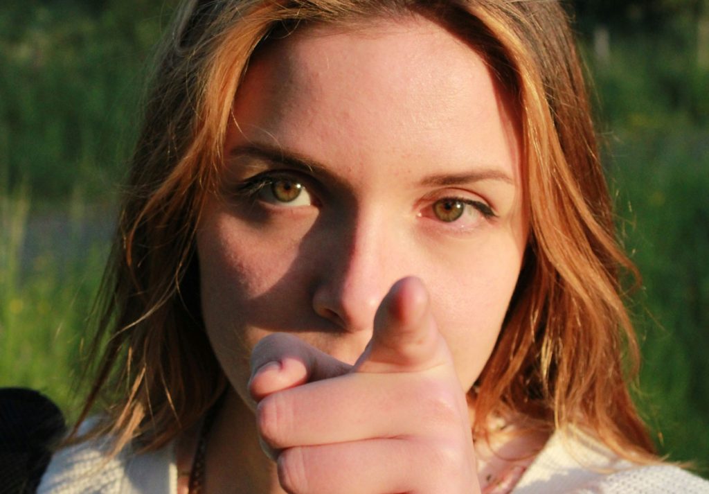 woman enabler pointing finger of narcissistic abuse