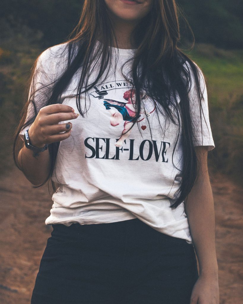 Girl in self love t-shirt to promote her new found love for herself